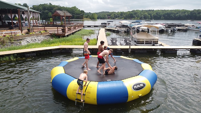Kids playing on water trampoline in the Lake of Egypt at Egyptian Hills Resort