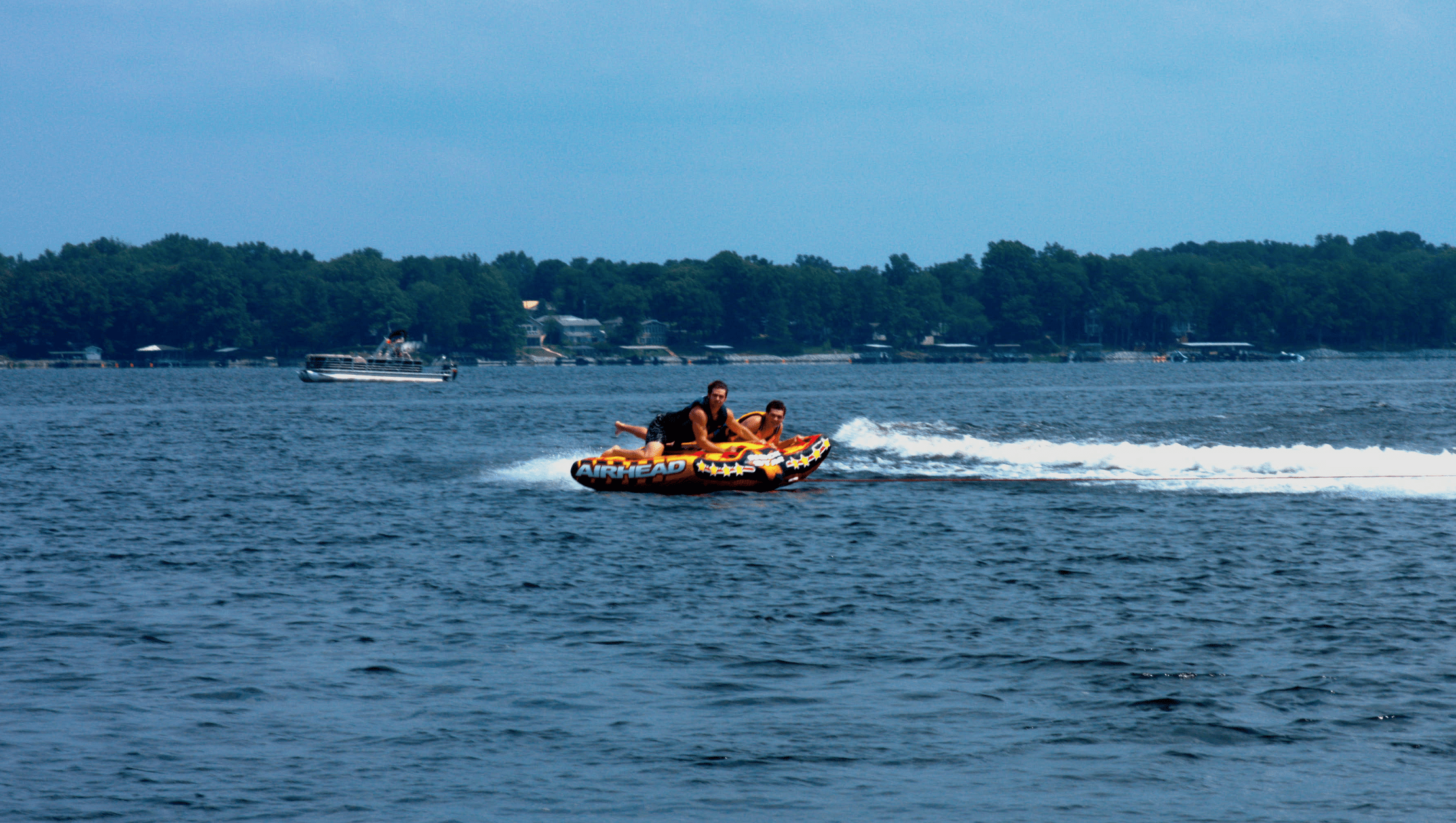 Two men riding tube on the Lake of Egypt in Southern Illinois